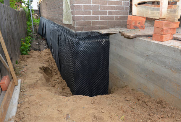 Happy homeowners after waterproofing job in Mill Creek
